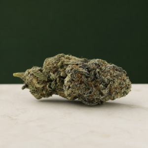 Atomic Blueberry AAA flower tapered side-angle macro with a visible stem