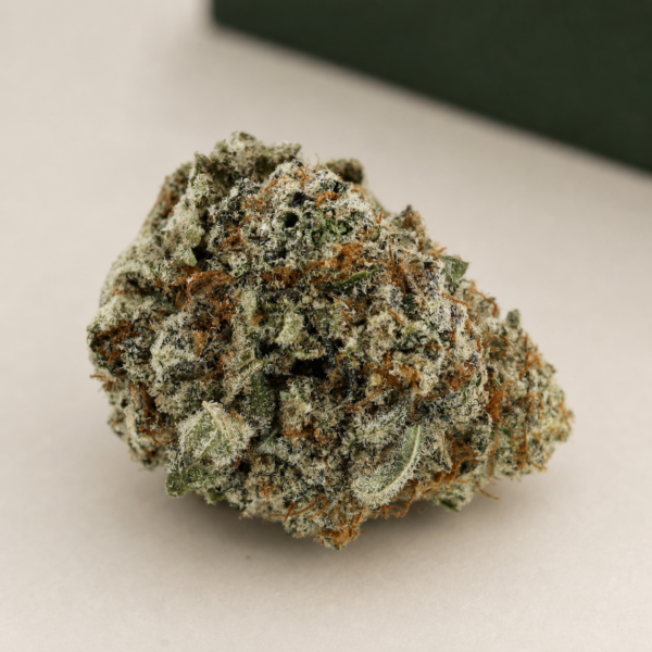 Blade Runner cannabis flower on a pale stone studio surface