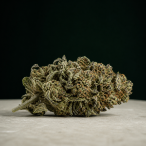 Deadband cannabis flower on a pale stone surface