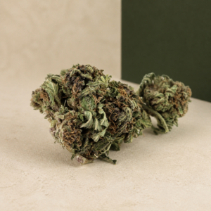 Deadfire OG AA flower two-bud studio macro showing mint-green detail