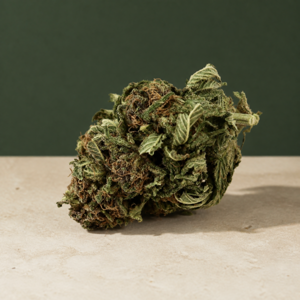 Deadfire OG AA flower macro on a pale stone studio surface
