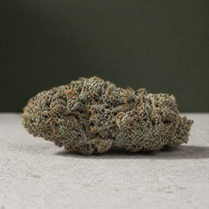 Flo-See cannabis flower on a pale stone surface