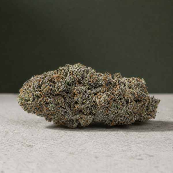 Flo-See cannabis flower on a pale stone surface