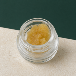Gelato 33 Live Resin open jar macro showing medium golden concentrate texture