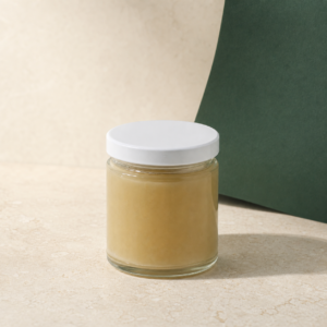 Gorilla Glue Live Resin closed concentrate jar on a pale stone studio surface