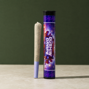 Gushin’ Grape Triple Infused Pre-Roll beside its colour-matched retail tube