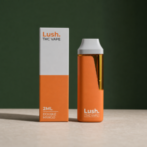 Lush Double Mango orange 2mL disposable vape beside its matching retail box