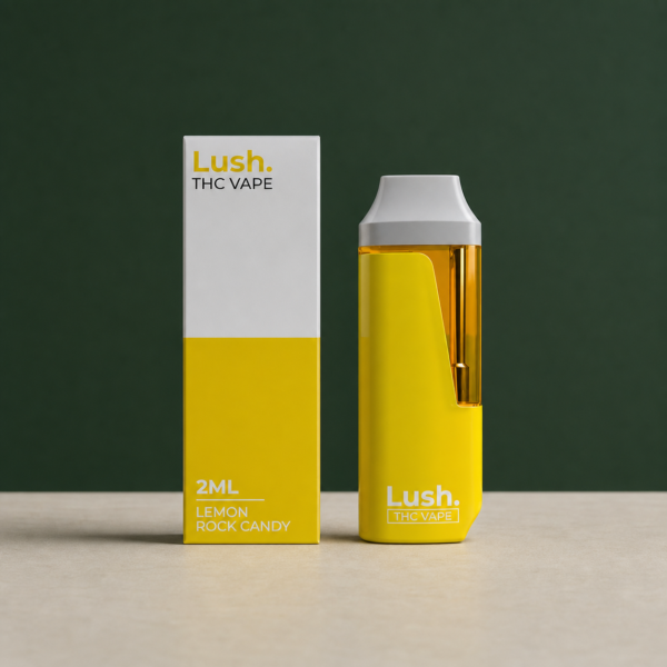 Lush Lemon Rock Candy yellow 2mL disposable vape beside its matching retail box