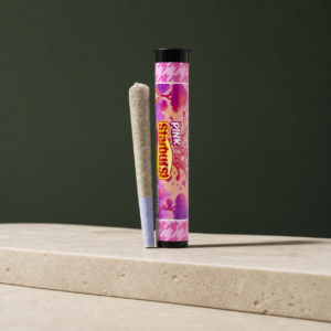 Pink Starburst Triple Infused Pre-Roll beside its colour-matched retail tube