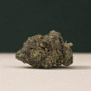 Psycho Kush AAAAA Reserve flower broadside macro with muted purple detail