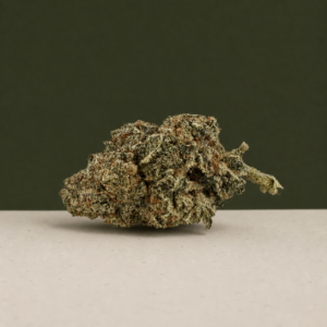 Rick James AAAA flower side-angle macro showing an irregular green bud
